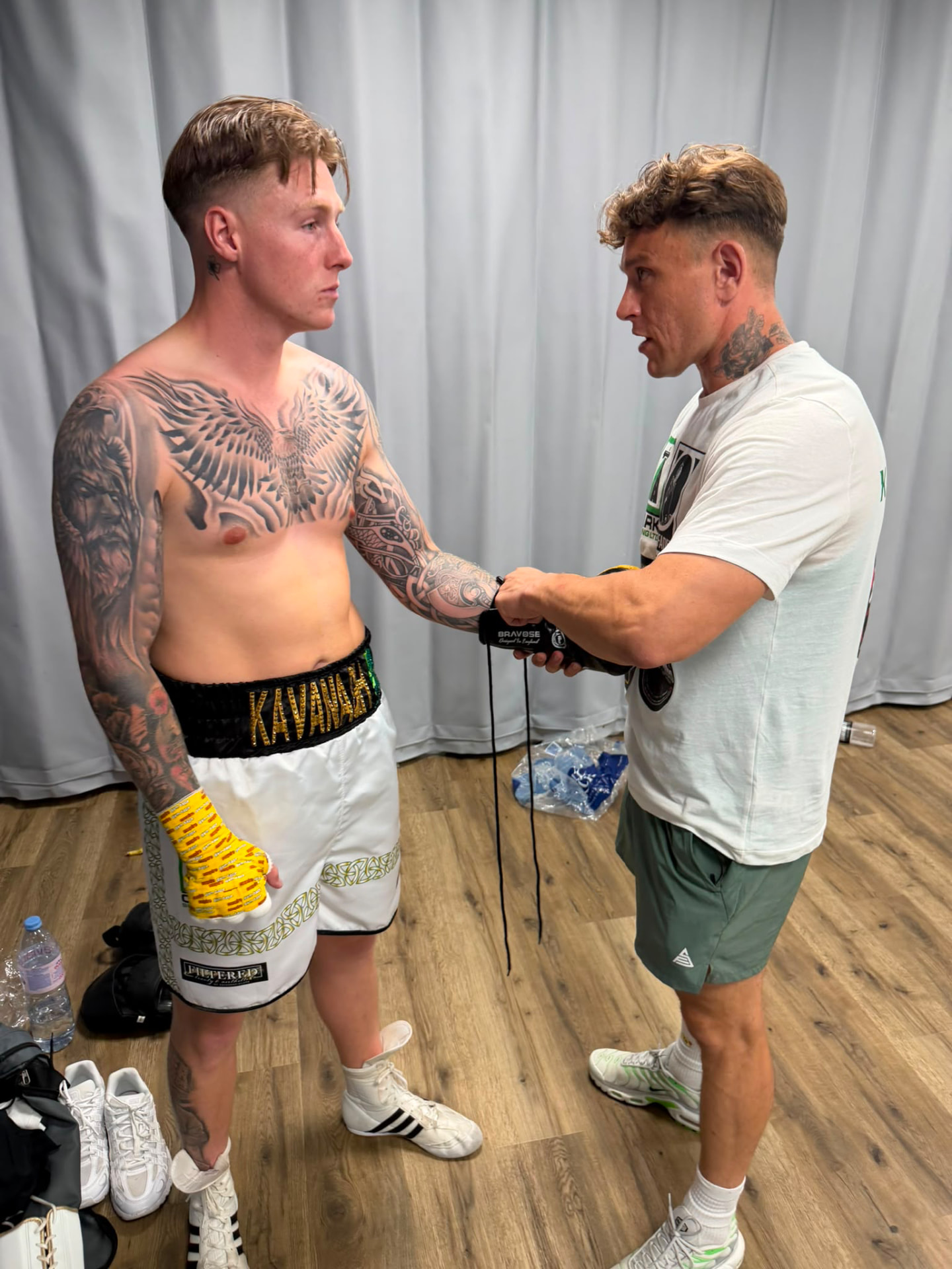 Hand wrapping backstage before a bout